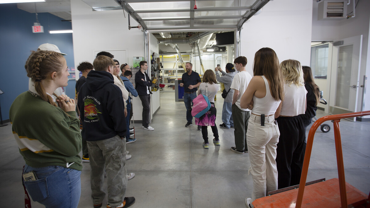Jerry Reif (center) speaks with Bay High students outside the woodshop in Nebraska innovation Studio Oct. 20, 2022.